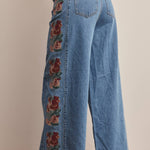 floral embroidered jeans, embroidered wide leg jeans, women’s wide leg denim, high rise wide leg jeans, floral denim, western embroidered jeans, boho wide leg jeans, medium wash jeans, statement denim, women’s fall jeans, boutique denim, embroidered denim pants