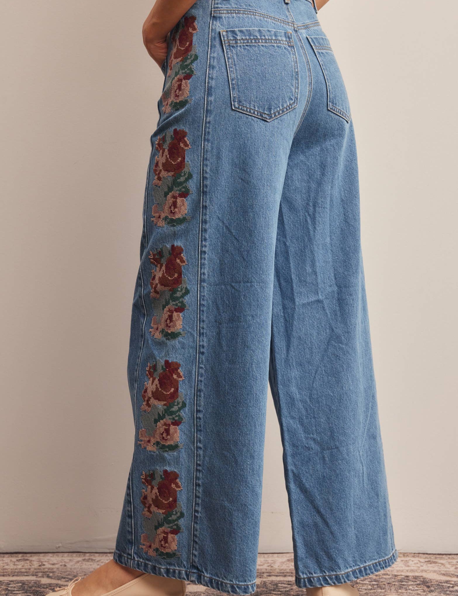 floral embroidered jeans, embroidered wide leg jeans, women’s wide leg denim, high rise wide leg jeans, floral denim, western embroidered jeans, boho wide leg jeans, medium wash jeans, statement denim, women’s fall jeans, boutique denim, embroidered denim pants