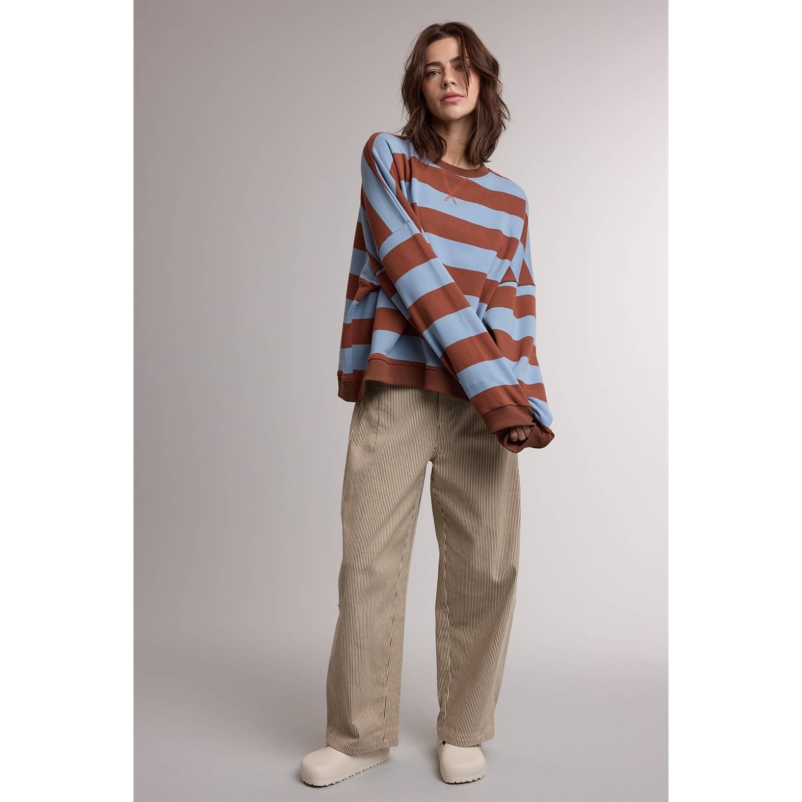 striped sweatshirt, oversized striped sweatshirt, retro striped pullover, blue and brown striped sweatshirt, women's crewneck sweatshirt, casual fall sweatshirt, collegiate style sweatshirt, cozy oversized pullover, women's boutique sweatshirt, west of may boutique