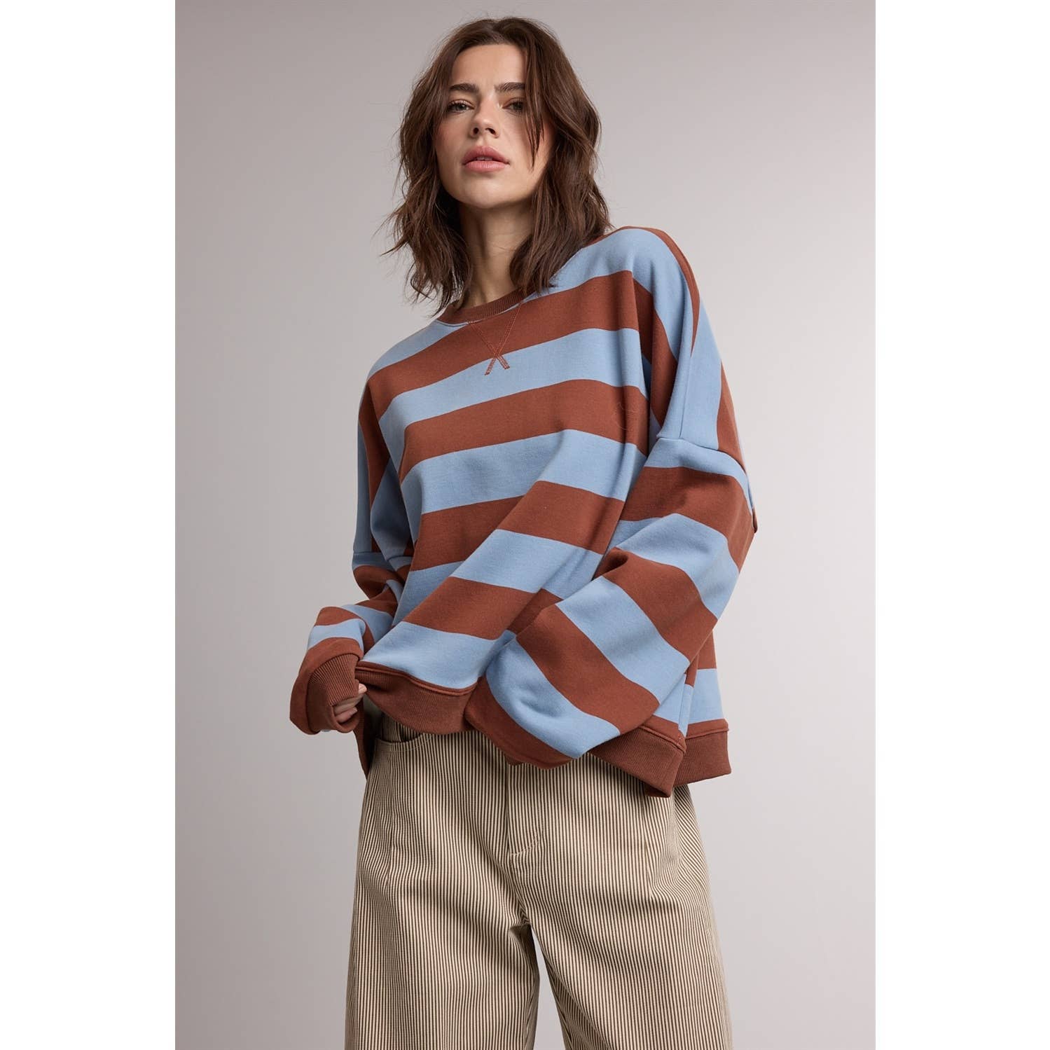 striped sweatshirt, oversized striped sweatshirt, retro striped pullover, blue and brown striped sweatshirt, women's crewneck sweatshirt, casual fall sweatshirt, collegiate style sweatshirt, cozy oversized pullover, women's boutique sweatshirt, west of may boutique