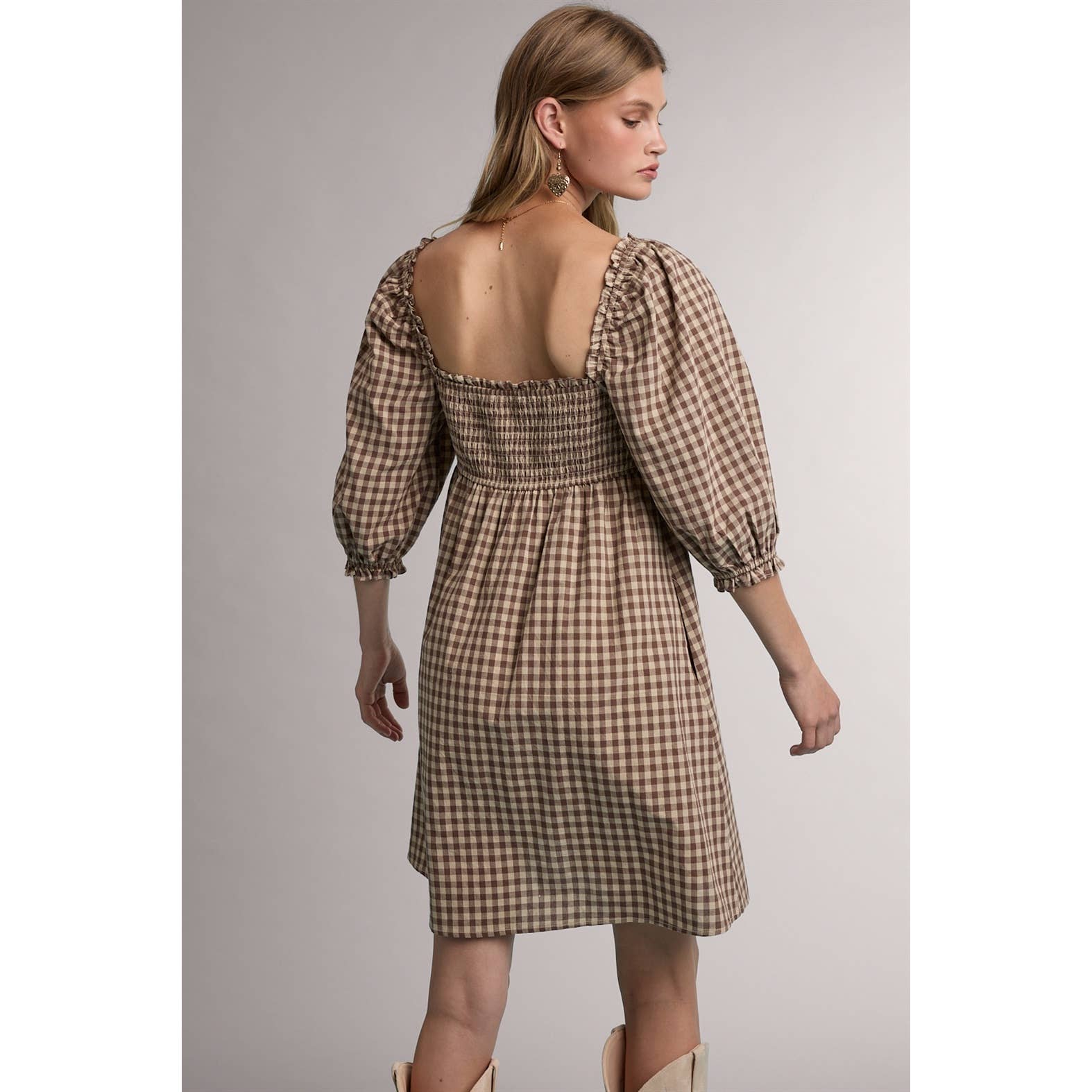 women's brown gingham dress, brown gingham mini dress, gingham babydoll dress, women's fall mini dress, square neck mini dress, smocked bodice dress, puff sleeve gingham dress, brown plaid dress, western fall dress, cowgirl mini dress, fall dress with boots, women's casual fall dress, cotton gingham dress, women's boutique fall clothing, western women's clothing, fall boutique dress, west of may