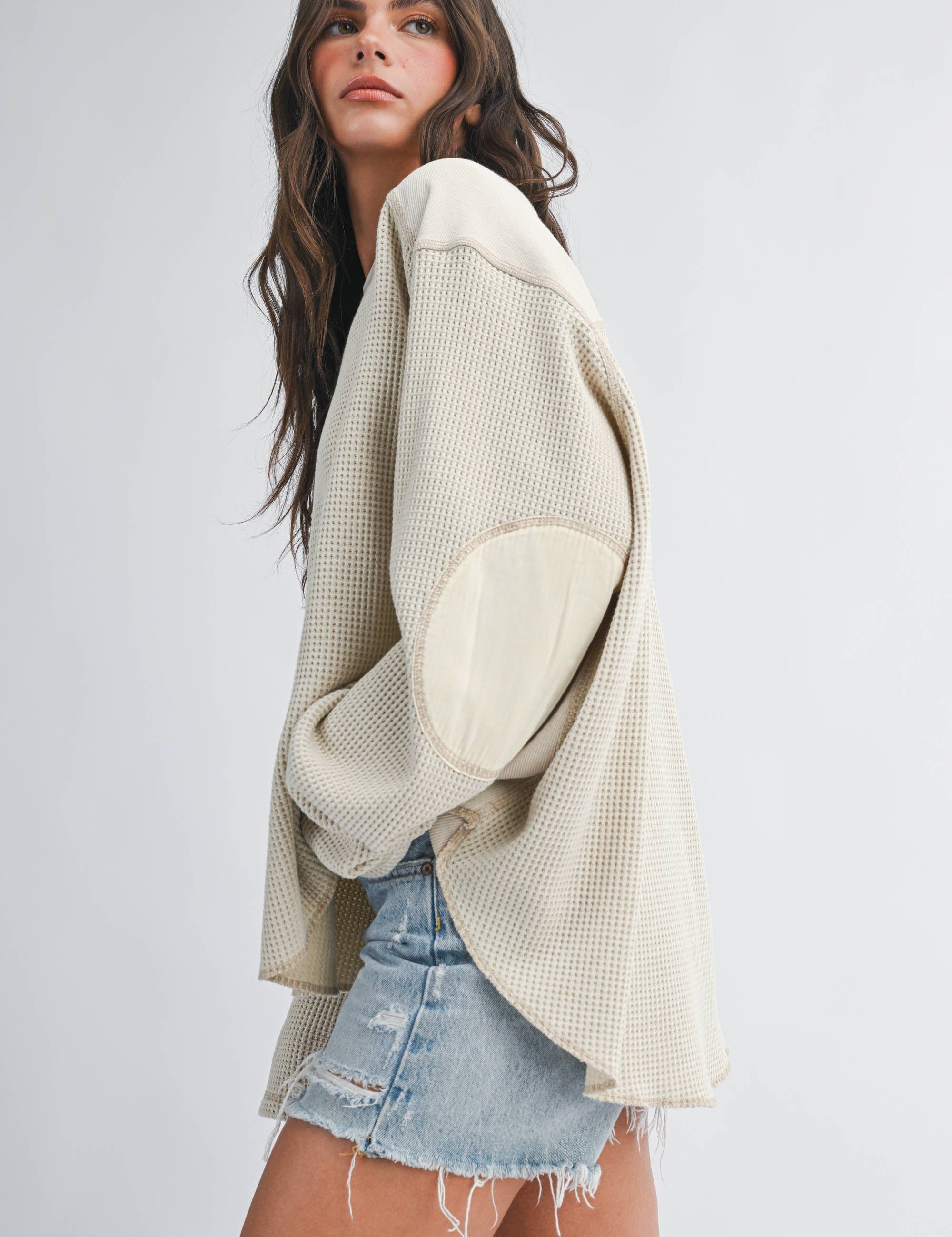 women's cream waffle knit thermal top with mixed fabric panels, long sleeves, drop shoulders, and oversized relaxed fit