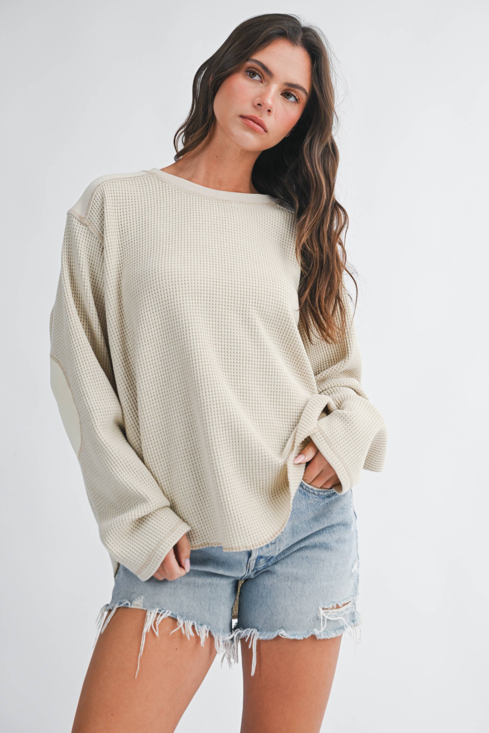 women's cream waffle knit thermal top with mixed fabric panels, long sleeves, drop shoulders, and oversized relaxed fit