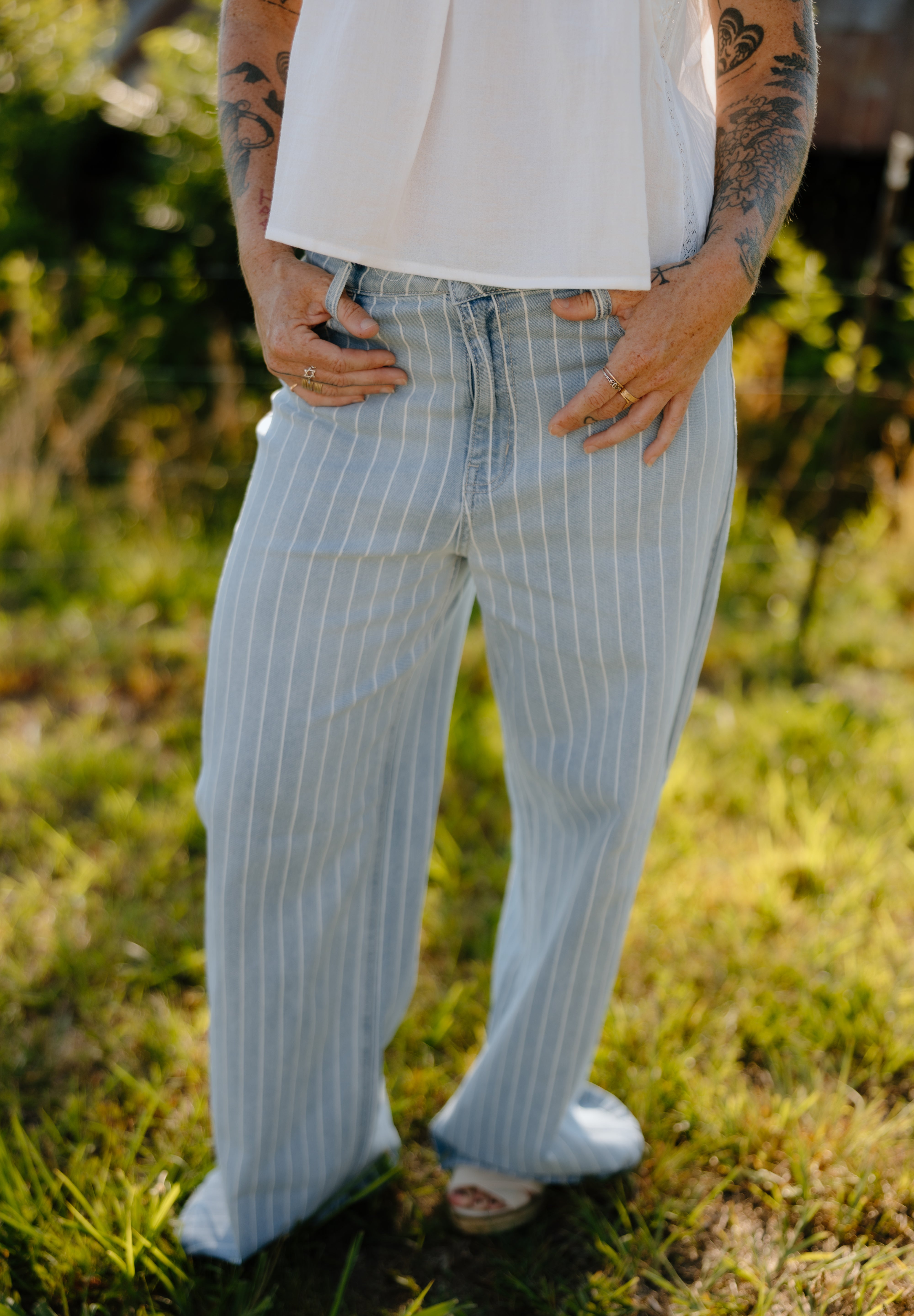 relax fit jeans, summer denim, light wash denim, striped denim, low rise denim, johnson city boutique, johnson city women's clothing, where to shop johnson city, casual outfit, cool girl aesthetic, tattoo aesthetic