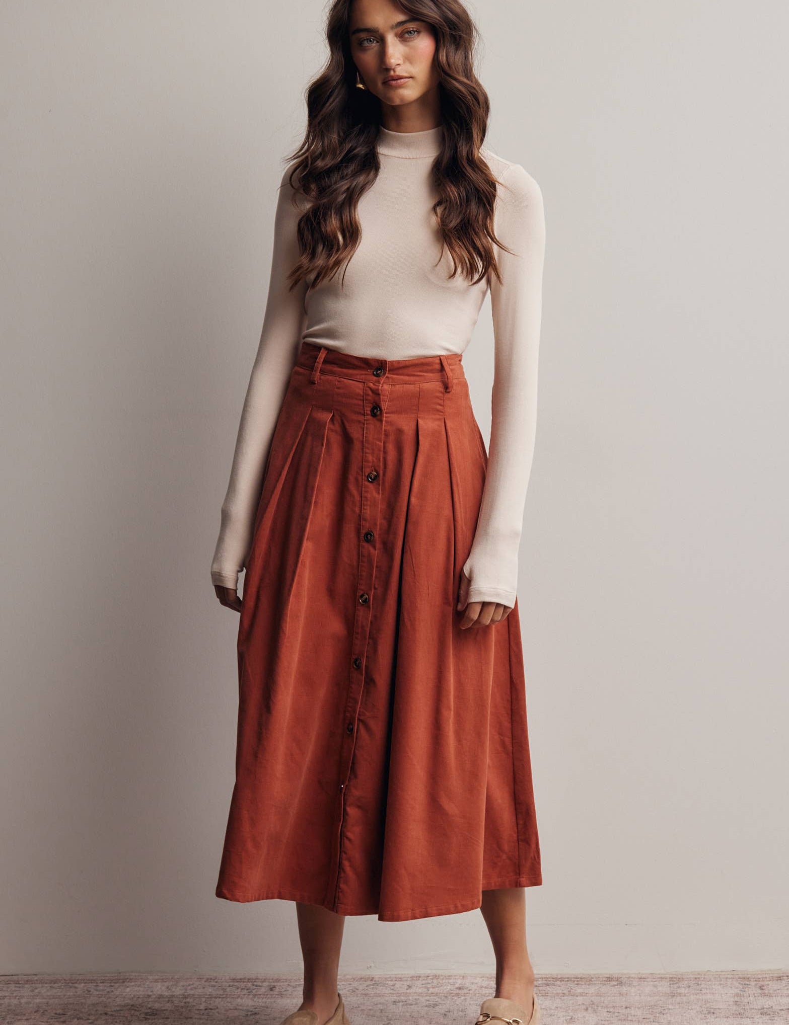 rust corduroy midi skirt, orange corduroy skirt, women’s button front skirt, a-line midi skirt, high waisted corduroy skirt, fall midi skirt, pleated midi skirt, women’s fall skirt, corduroy skirt with pockets, thanksgiving outfit skirt, western midi skirt, boutique fall skirt