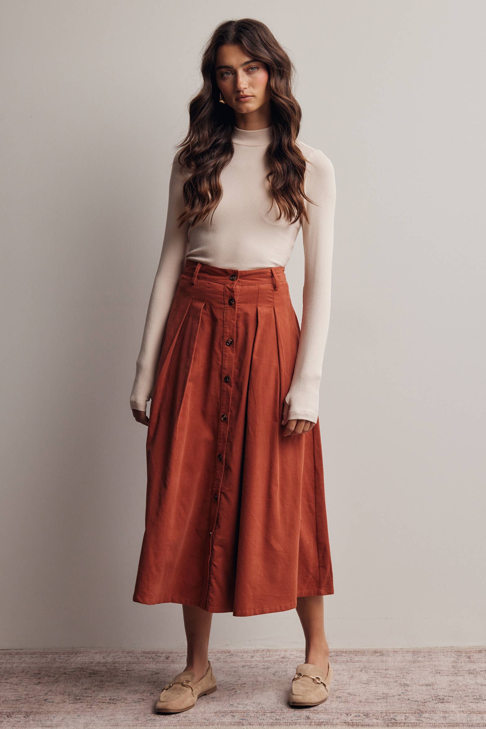 rust corduroy midi skirt, orange corduroy skirt, women’s button front skirt, a-line midi skirt, high waisted corduroy skirt, fall midi skirt, pleated midi skirt, women’s fall skirt, corduroy skirt with pockets, thanksgiving outfit skirt, western midi skirt, boutique fall skirt