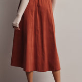 rust corduroy midi skirt, orange corduroy skirt, women’s button front skirt, a-line midi skirt, high waisted corduroy skirt, fall midi skirt, pleated midi skirt, women’s fall skirt, corduroy skirt with pockets, thanksgiving outfit skirt, western midi skirt, boutique fall skirt