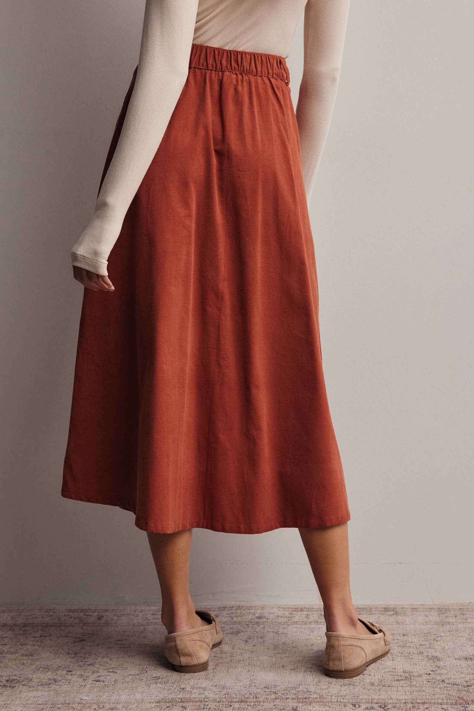 rust corduroy midi skirt, orange corduroy skirt, women’s button front skirt, a-line midi skirt, high waisted corduroy skirt, fall midi skirt, pleated midi skirt, women’s fall skirt, corduroy skirt with pockets, thanksgiving outfit skirt, western midi skirt, boutique fall skirt