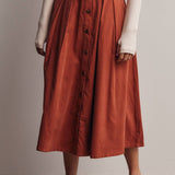 rust corduroy midi skirt, orange corduroy skirt, women’s button front skirt, a-line midi skirt, high waisted corduroy skirt, fall midi skirt, pleated midi skirt, women’s fall skirt, corduroy skirt with pockets, thanksgiving outfit skirt, western midi skirt, boutique fall skirt