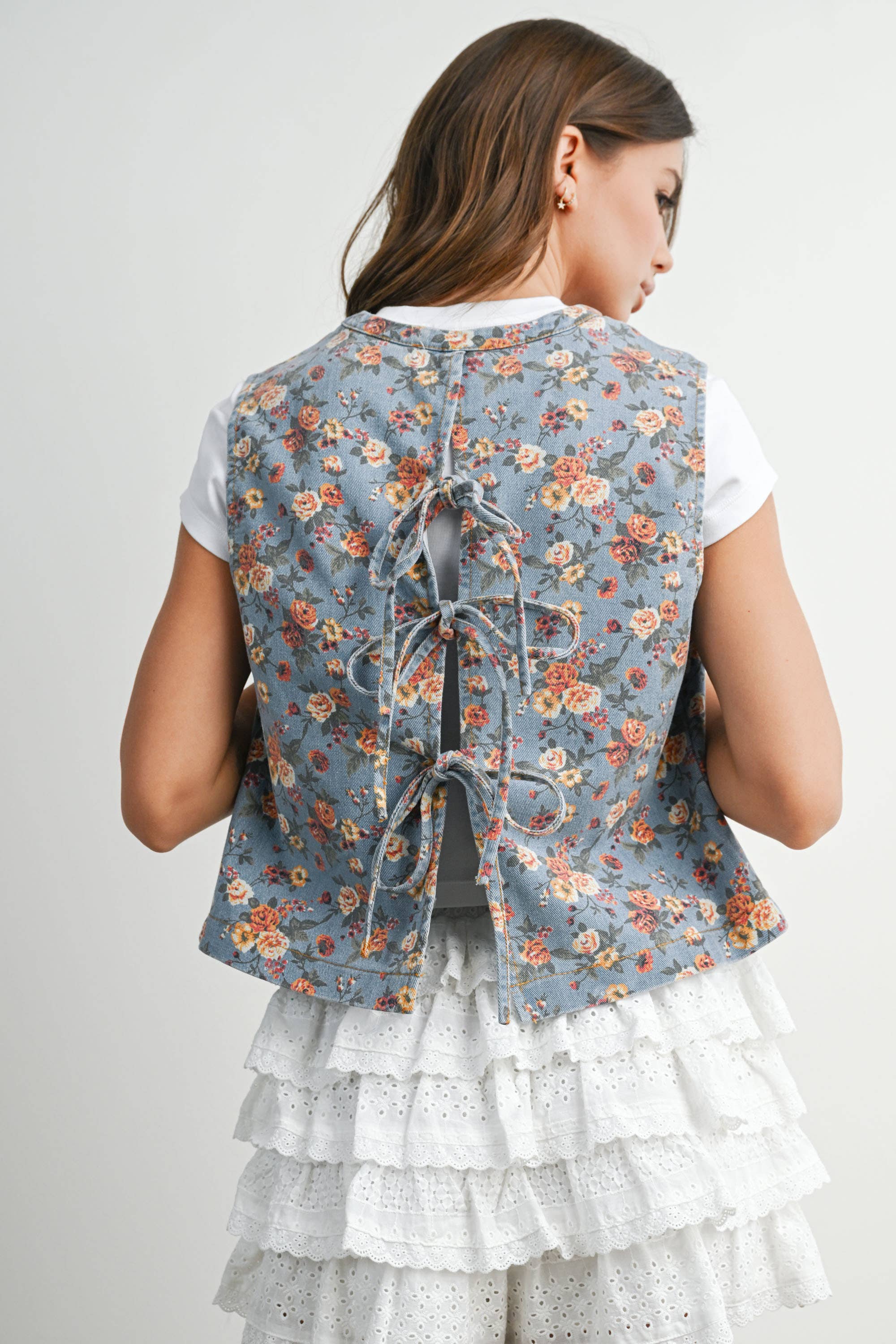 floral tie-front vest, cotton floral vest, women's floral vest, blue floral vest, tie-front vest, cottagecore vest, vintage inspired vest, layering vest, sleeveless floral top, fall layering piece, women's boutique vest, west of may boutique