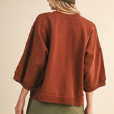 oversized button-up sweatshirt, cotton button-up sweatshirt, oversized cotton top, rust sweatshirt, exposed seam sweatshirt, relaxed fit sweatshirt, lightweight sweatshirt jacket, fall layering top, casual women's sweatshirt, boutique fall top, west of may boutique, free people dupe, boho style