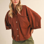 oversized button-up sweatshirt, cotton button-up sweatshirt, oversized cotton top, rust sweatshirt, exposed seam sweatshirt, relaxed fit sweatshirt, lightweight sweatshirt jacket, fall layering top, casual women's sweatshirt, boutique fall top, west of may boutique, free people dupe, boho style