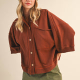 oversized button-up sweatshirt, cotton button-up sweatshirt, oversized cotton top, rust sweatshirt, exposed seam sweatshirt, relaxed fit sweatshirt, lightweight sweatshirt jacket, fall layering top, casual women's sweatshirt, boutique fall top, west of may boutique, free people dupe, boho style