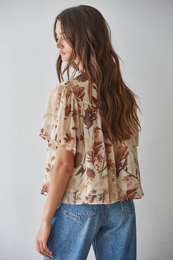 women's cream floral blouse, cream and brown floral top, brown floral blouse women, floral mock neck blouse, fall floral blouse, women's chiffon floral top, short sleeve floral blouse, flutter sleeve floral top, vintage floral blouse, western floral blouse, prairie floral top, boho western blouse, women's fall blouse, neutral floral top, cream fall top women, brown floral fall top, floral top with jeans, western fall outfit women, cowgirl fall outfit, women's western clothing, women's boutique tops